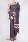 Purple Tussar Silk Saree with Zari Butta on the body and Ikat Border.  displayed on a mannequin