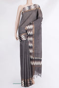 Grey Tussar Saree with Thread Butta on the body and Ikat Border.  displayed on a mannequin