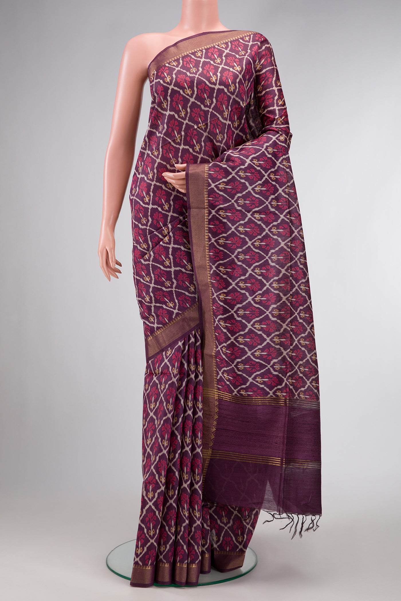 Purple Dual Tone Tussar Silk Saree with Ikat Print on the body and Zari Border.  displayed on a mannequin