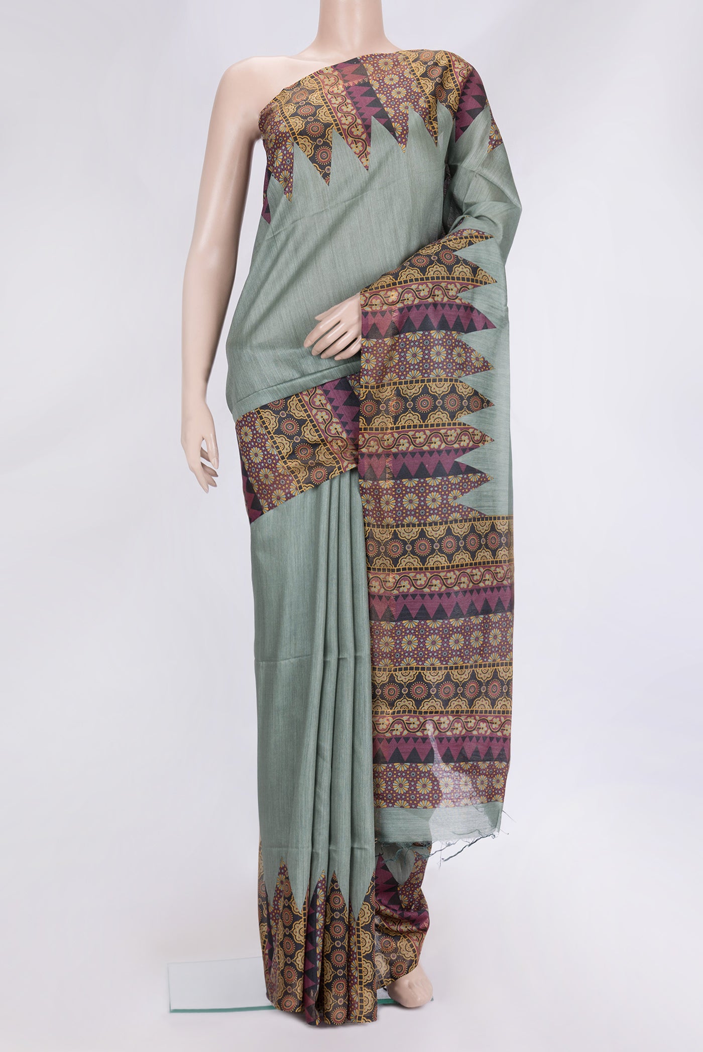 Green Dual Tone Tussar Silk Saree with Plain Body and Fancy Border.  displayed on a mannequin