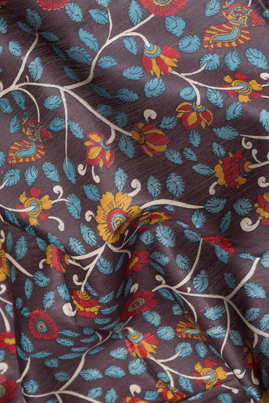 Close up of Brown Tussar Silk Saree with Printed design on the body and Fancy Border.  displaying folds