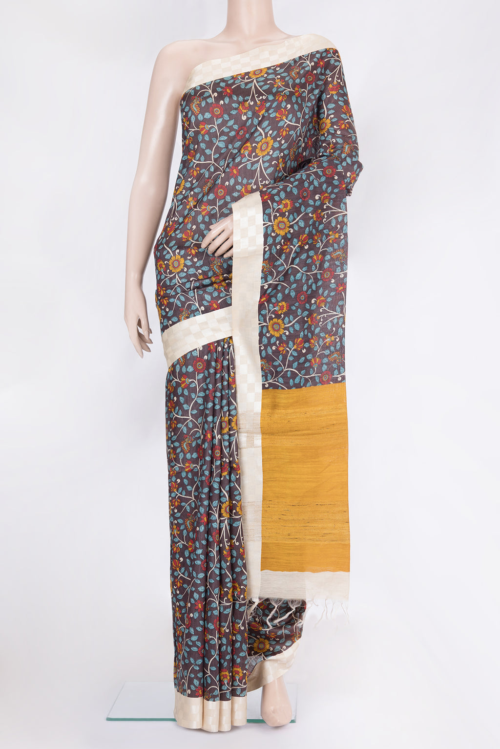 Brown Tussar Silk Saree with Printed design on the body and Fancy Border.  displayed on a mannequin