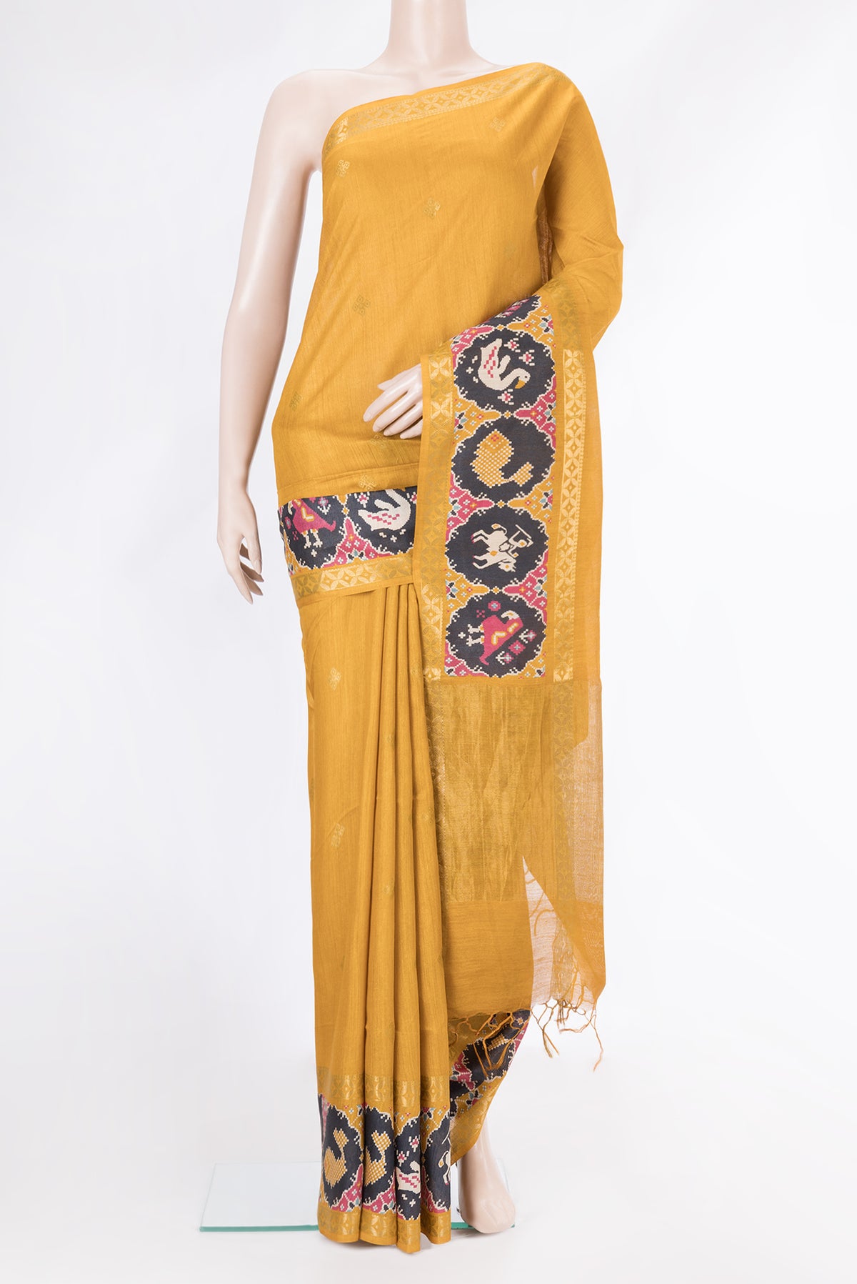Mustard Dual Tone Tussar Silk Saree with Zari Butta on the body and Fancy Border.  displayed on a mannequin