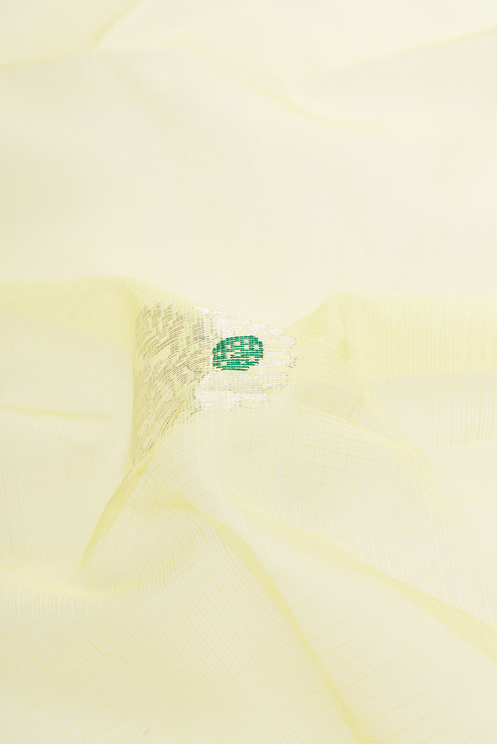 Close up of Yellow Dual Tone Kota Silk Saree with Zari And Thread Butta on the body and Zari Border.  displaying folds