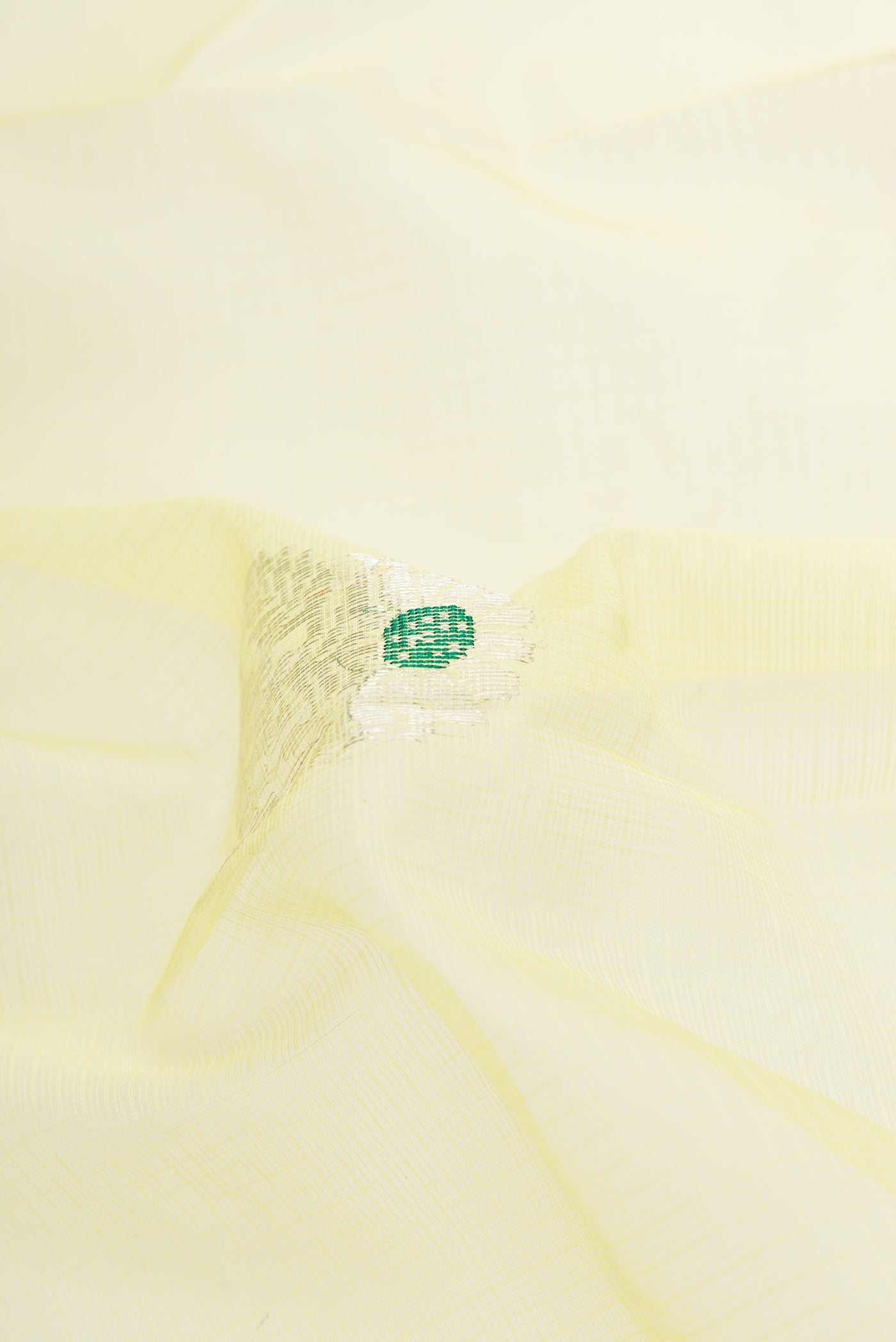 Close up of Yellow Dual Tone Kota Silk Saree with Zari And Thread Butta on the body and Zari Border.  displaying folds