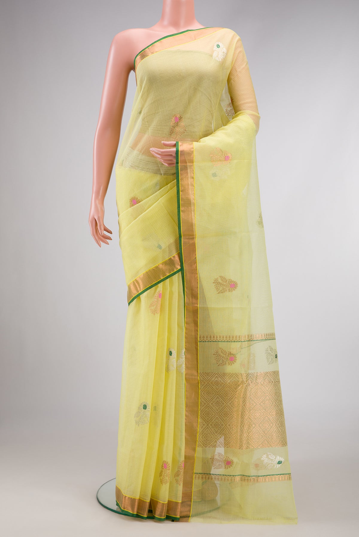 Yellow Dual Tone Kota Silk Saree with Zari And Thread Butta on the body and Zari Border.  displayed on a mannequin