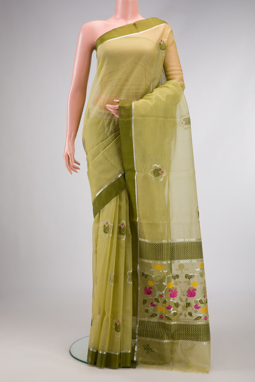 Pista Green Dual Tone Kota Silk Saree with Zari And Thread Butta on the body and Zari Border.  displayed on a mannequin