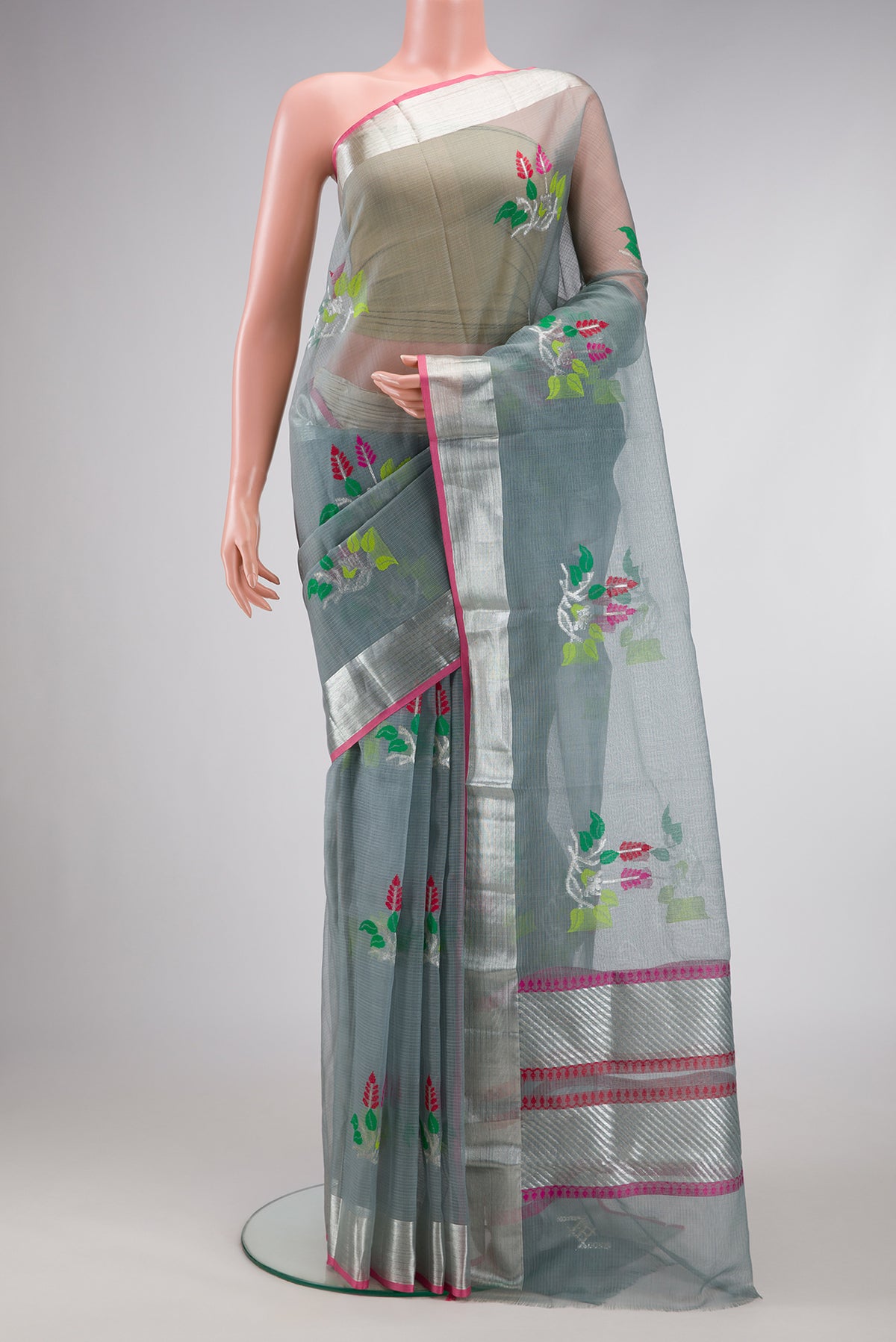 Grey Dual Tone Kota Silk Saree with Zari And Thread Butta on the body and Zari Border.  displayed on a mannequin