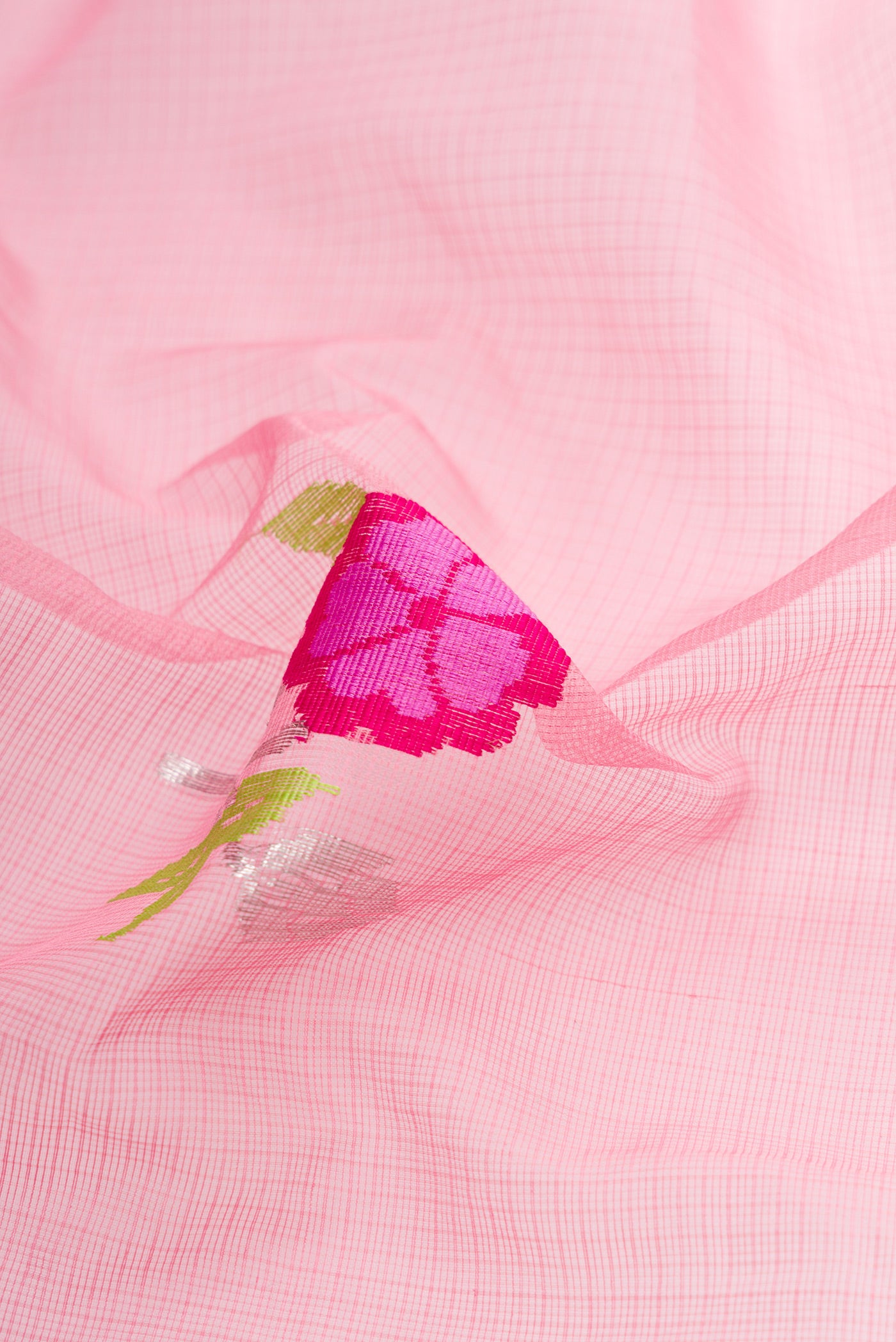 Close up of Pink Dual Tone Kota Silk Saree with Zari And Thread Butta on the body and Zari Border.  displaying folds