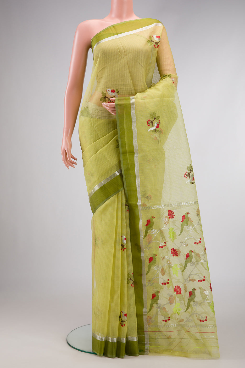 Pista Green Dual Tone Kota Silk Saree with Zari And Thread Butta on the body and Zari Border.  displayed on a mannequin