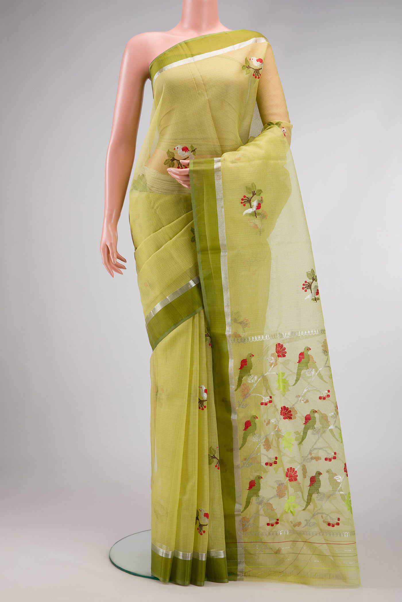 Pista Green Dual Tone Kota Silk Saree with Zari And Thread Butta on the body and Zari Border.  displayed on a mannequin