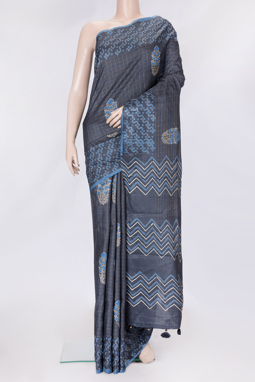Grey Dual Tone Tussar Silk Saree with Checked design on the body and Printed Border.  displayed on a mannequin