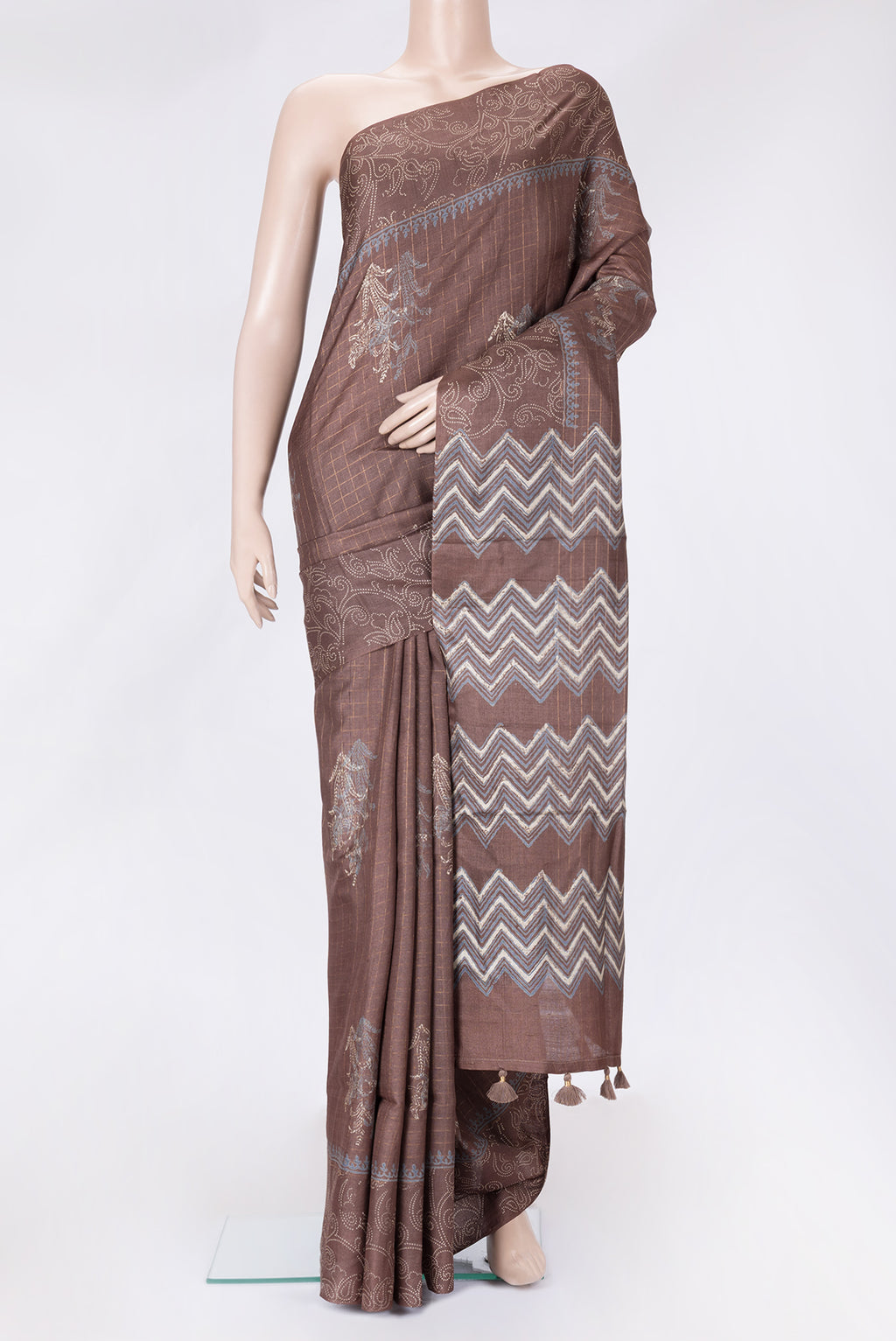 Brown Dual Tone Tussar Silk Saree with Checked design on the body and Printed Border.  displayed on a mannequin