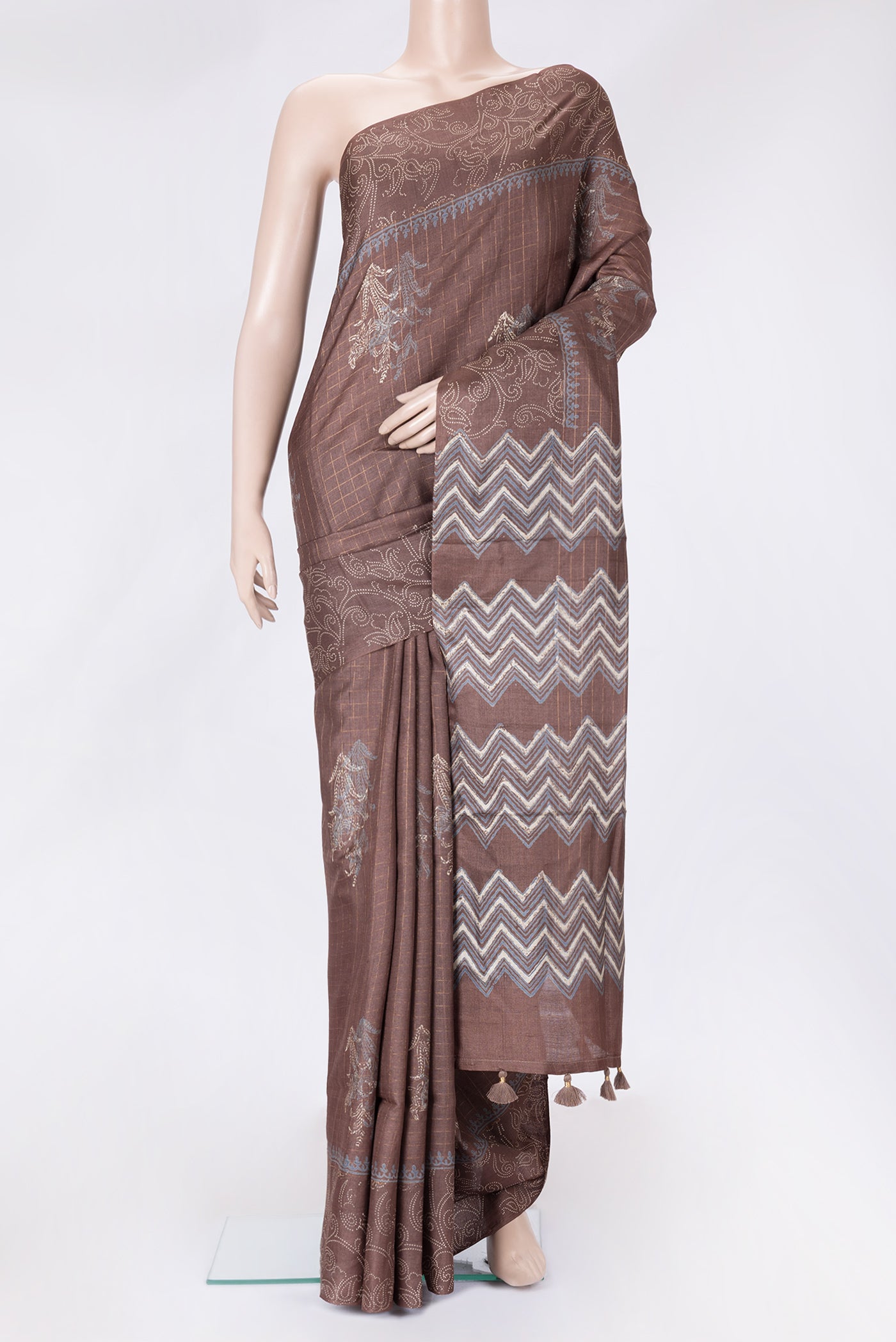 Brown Dual Tone Tussar Silk Saree with Checked design on the body and Printed Border.  displayed on a mannequin
