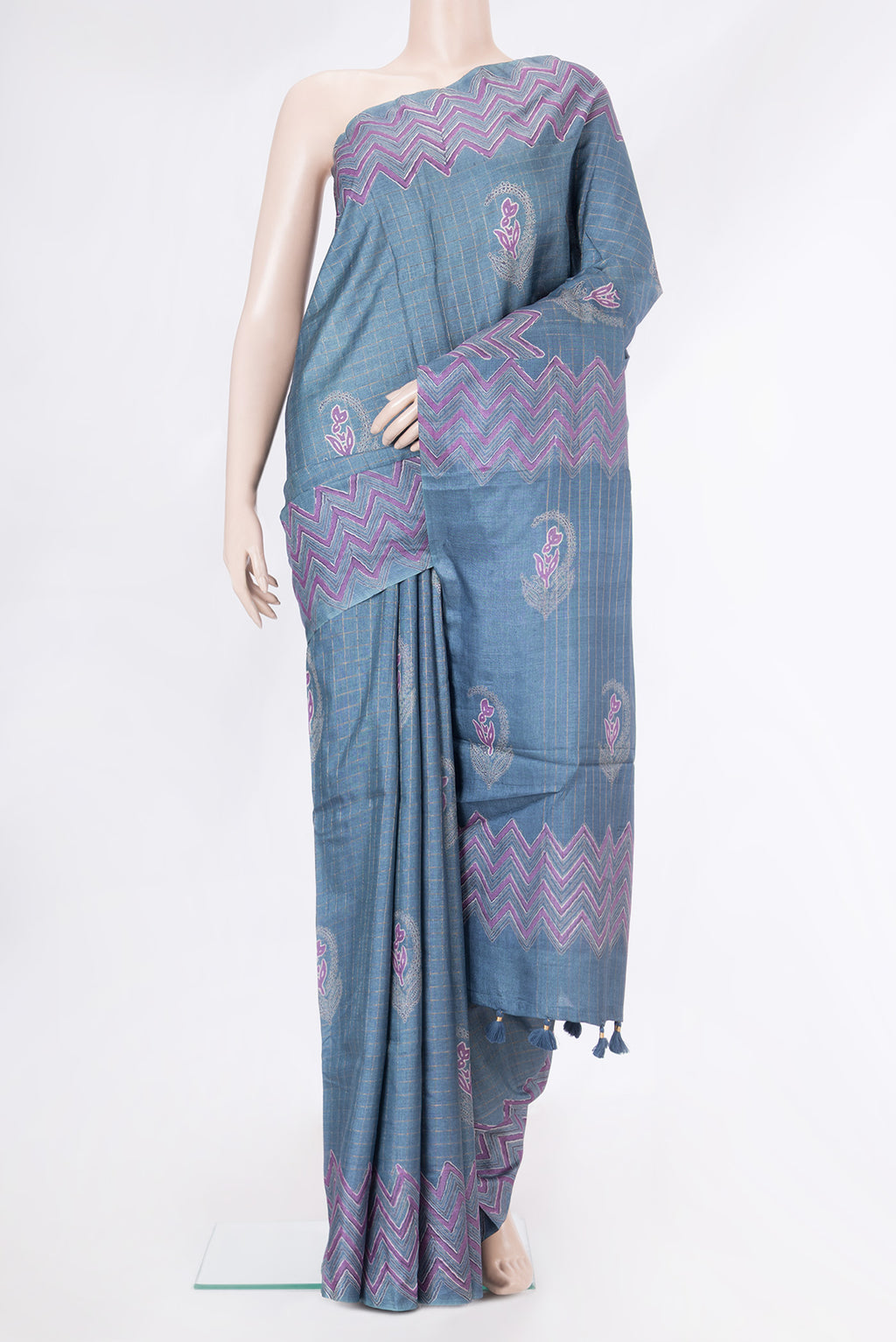Blue Grey Tussar Silk Saree with Checked design on the body and Fancy Border.  displayed on a mannequin