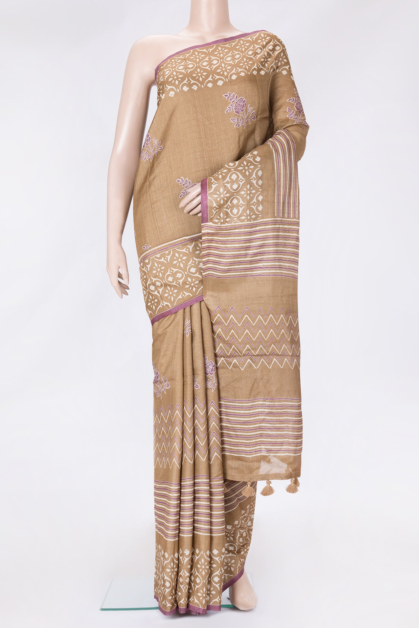Caramel Dual Tone Tussar Silk Saree with Printed design on the body and Printed Border.  displayed on a mannequin