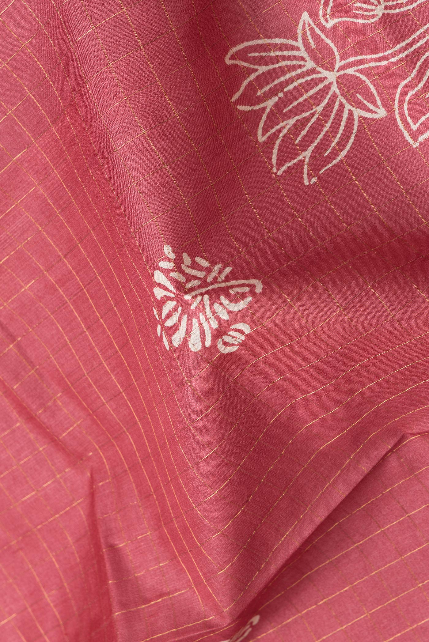 Close up of Pink Dual Tone Tussar Silk Saree with Checked design on the body and Printed Border.  displaying folds