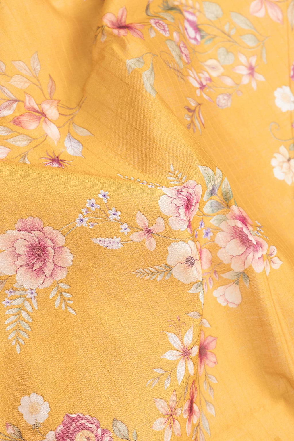 Close up of Mustard Dual Tone Chanderi Silk Saree with Printed design on the body and Zari And Thread Border.  displaying folds