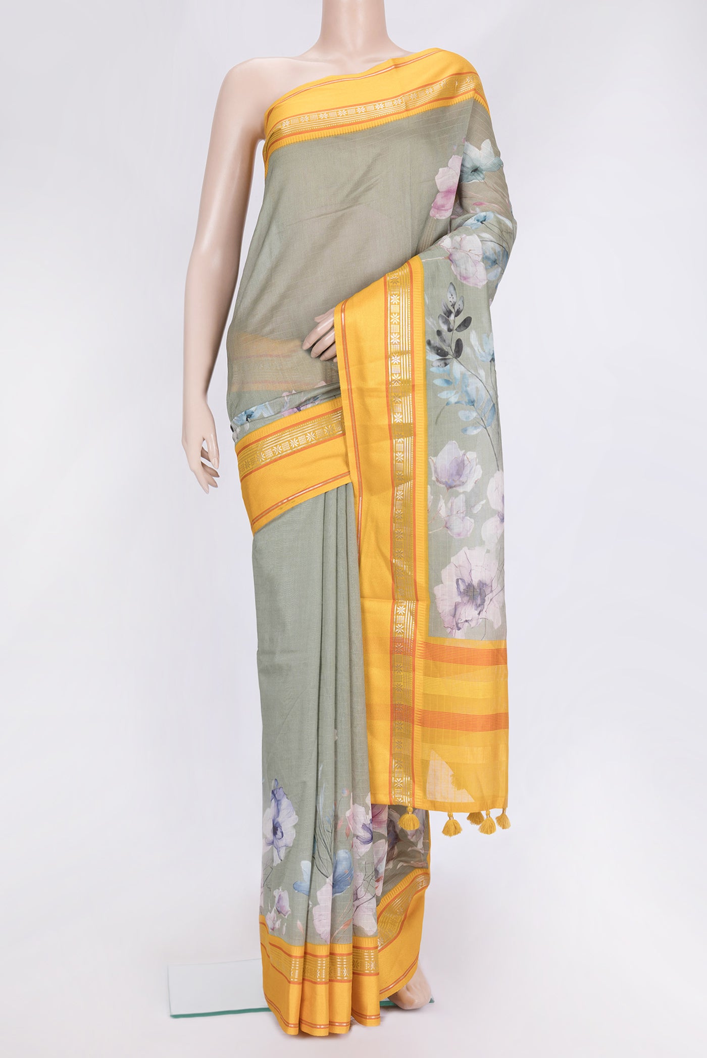 Pista Green Dual Tone Chanderi Silk Saree with Printed design on the body and Zari And Thread Border.  displayed on a mannequin