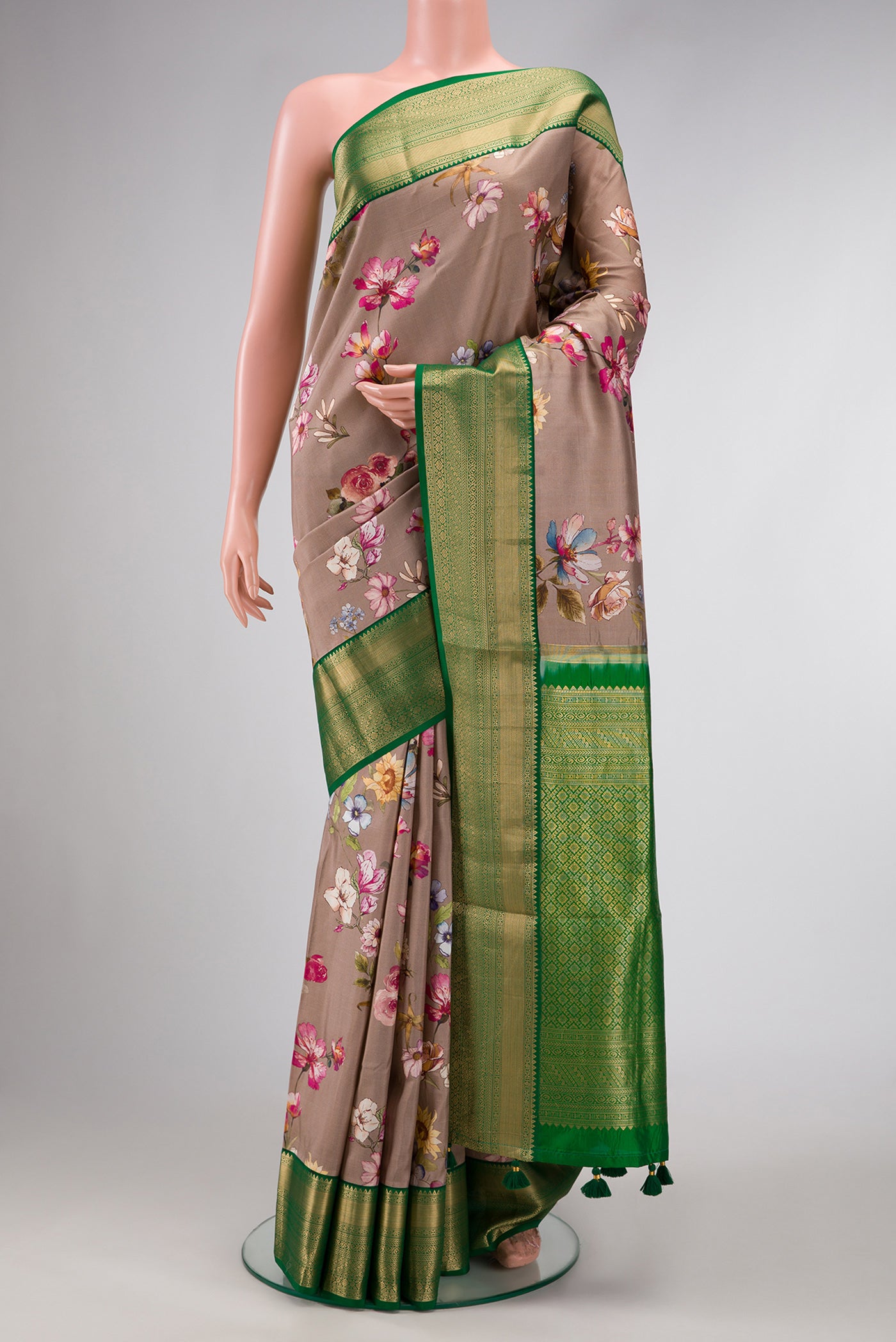 Brown Dual Tone Kanchipuram Silk Saree with Printed design on the body and Zari Border.  displayed on a mannequin