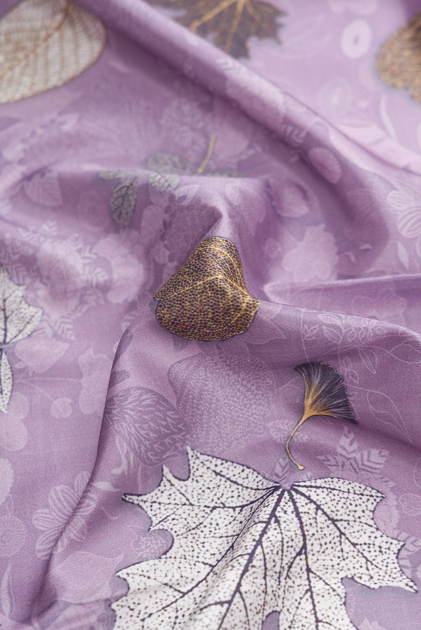 Close up of Lavender Dual Tone Kanchipuram Silk Saree with Printed design on the body and Zari Border.  displaying folds