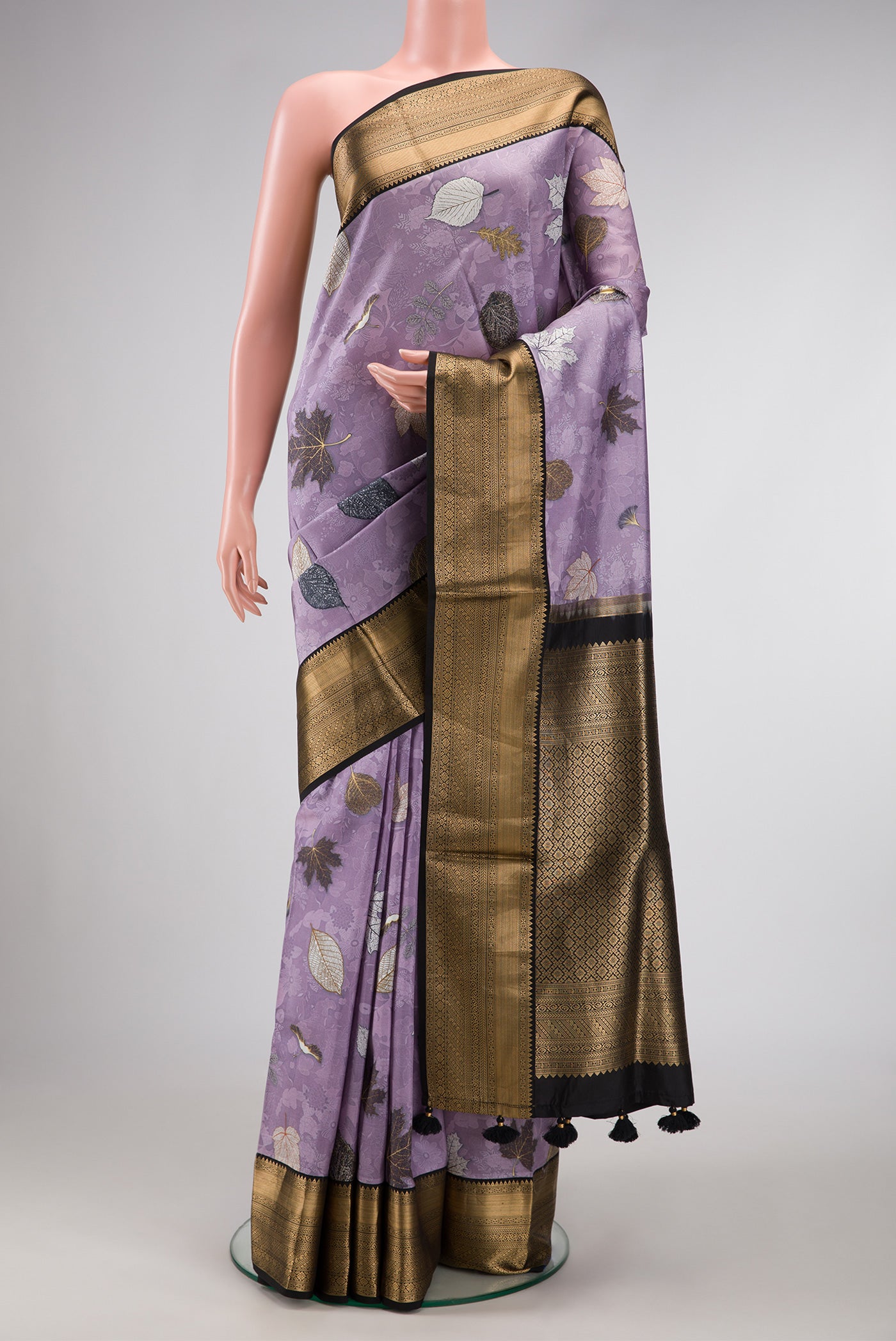 Lavender Dual Tone Kanchipuram Silk Saree with Printed design on the body and Zari Border.  displayed on a mannequin