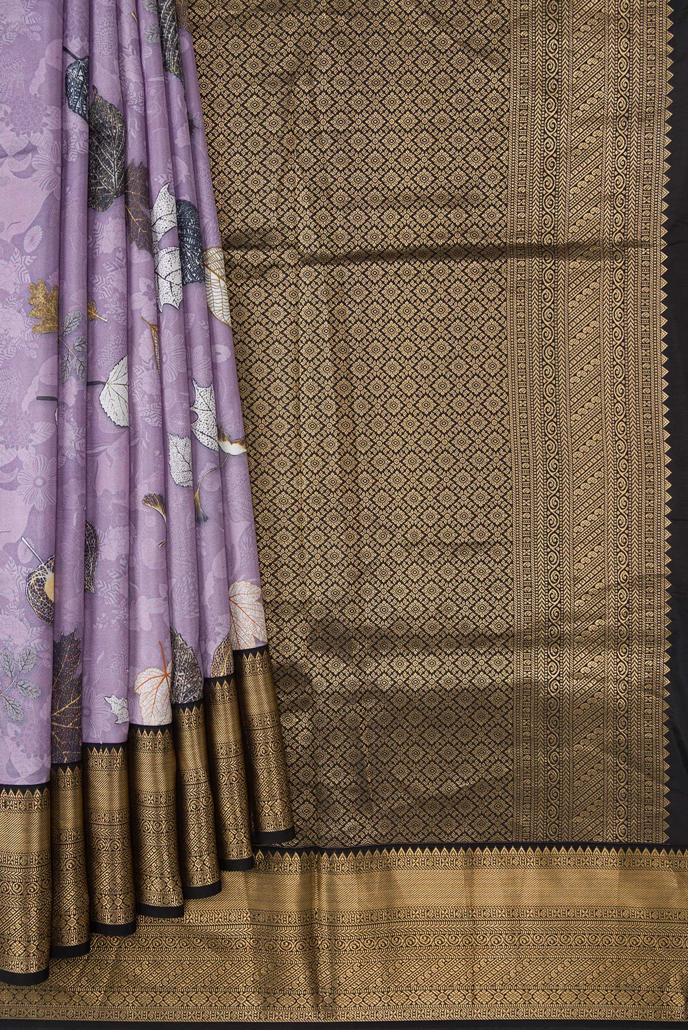 Pleats and pallu of Lavender Dual Tone Kanchipuram Silk Saree with Printed design on the body and Zari Border. 