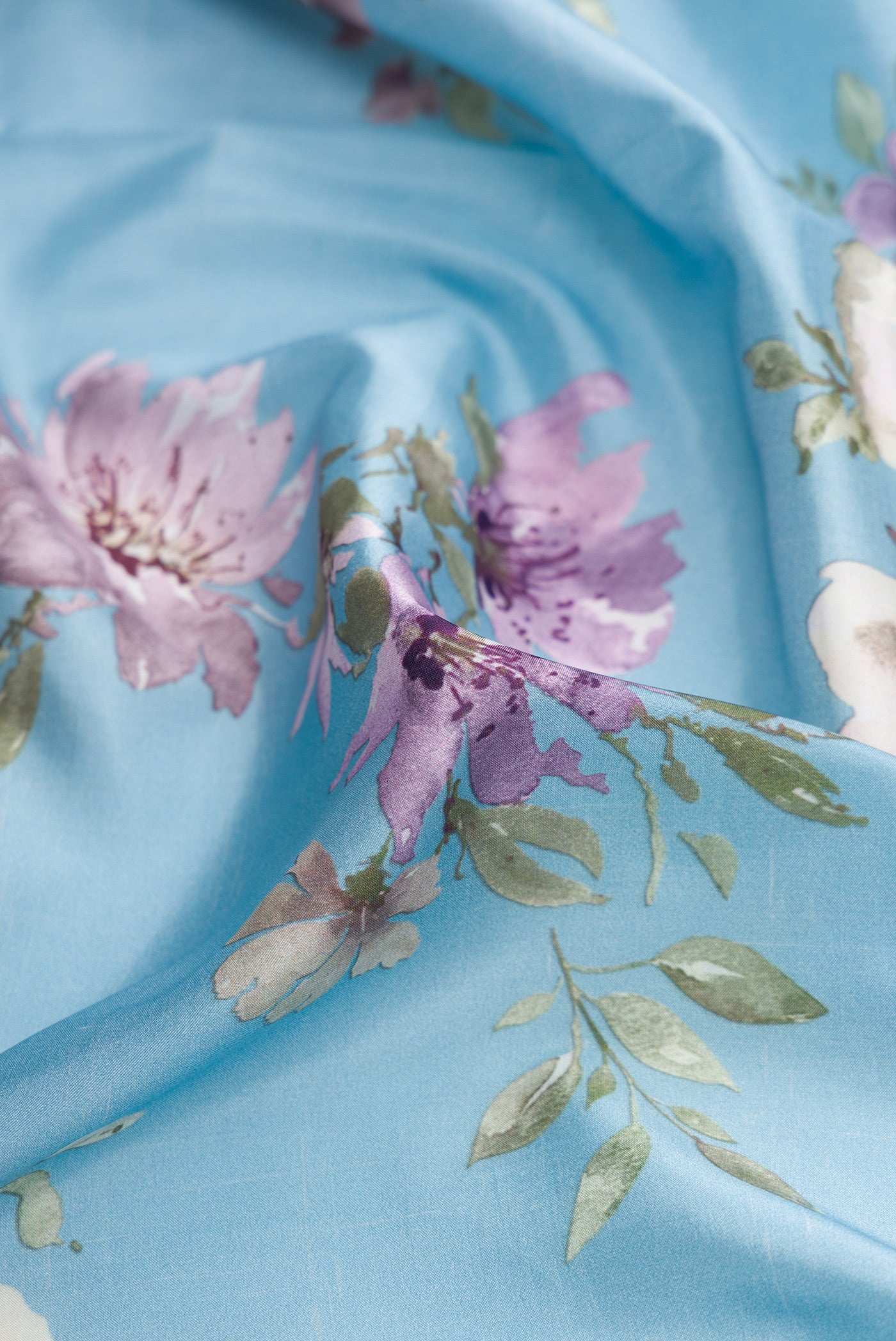 Close up of Sky Blue Dual Tone Kanchipuram Silk Saree with Printed design on the body and Zari Border.  displaying folds