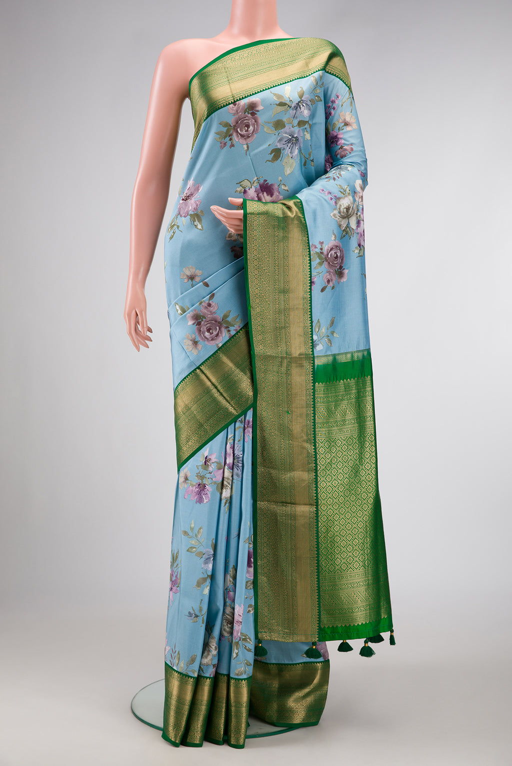 Sky Blue Dual Tone Kanchipuram Silk Saree with Printed design on the body and Zari Border.  displayed on a mannequin