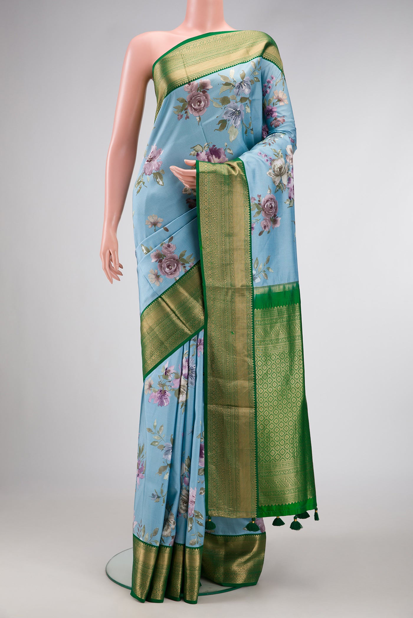 Sky Blue Dual Tone Kanchipuram Silk Saree with Printed design on the body and Zari Border.  displayed on a mannequin