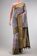Grey Dual Tone Kanchipuram Silk Saree with Printed design on the body and Zari Border.  displayed on a mannequin