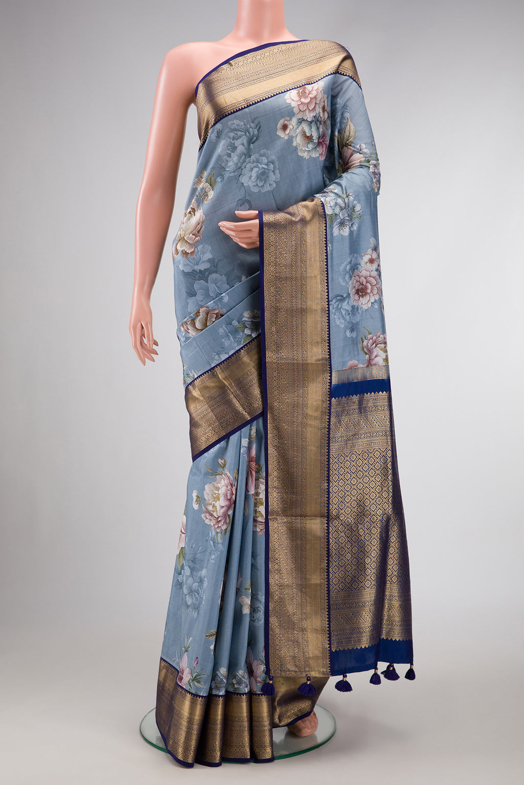 Grey Dual Tone Kanchipuram Silk Saree with Printed design on the body and Zari Border.  displayed on a mannequin