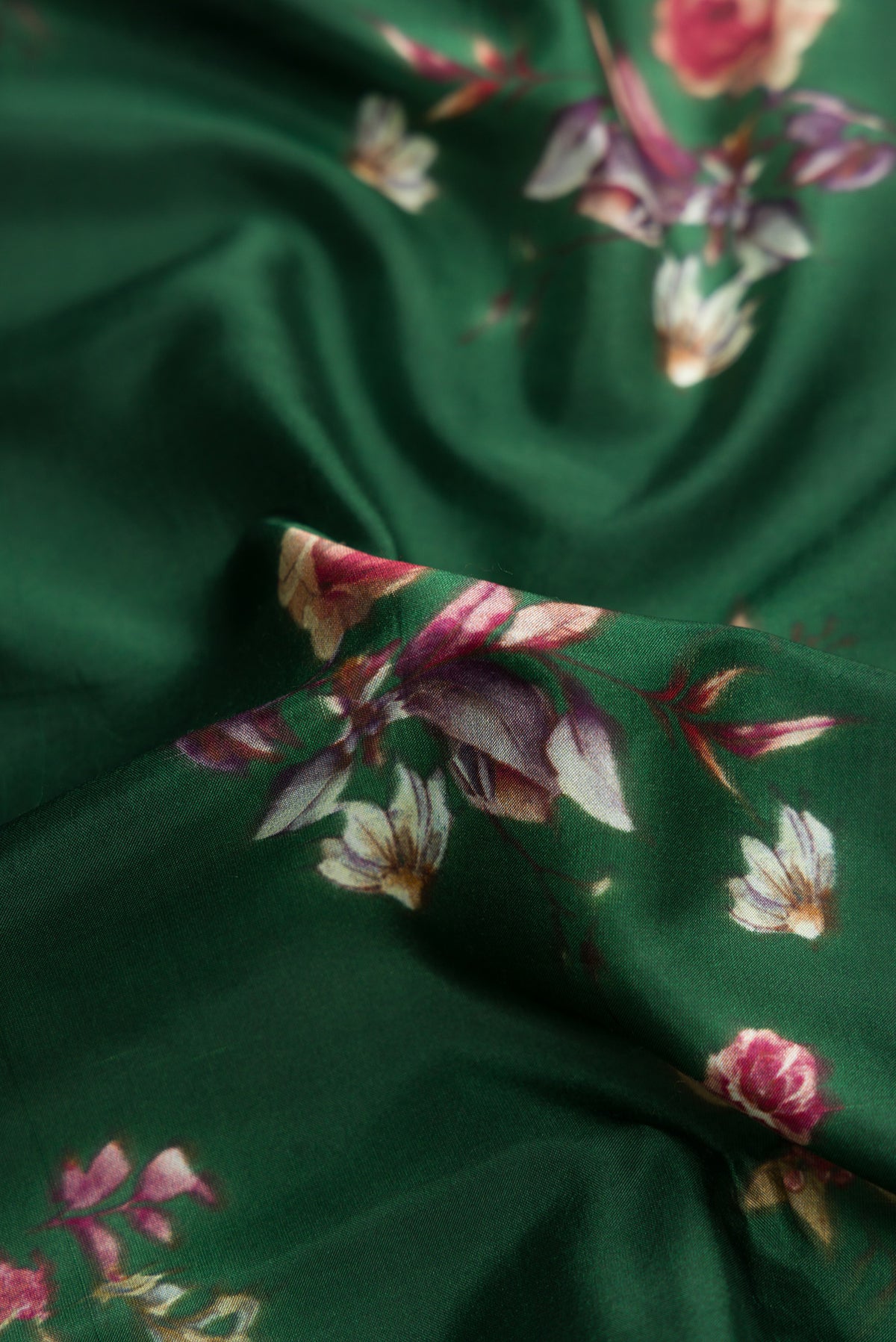 Close up of Green Dual Tone Kanchipuram Silk Saree with Printed design on the body and Zari Border.  displaying folds