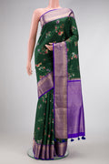 Green Dual Tone Kanchipuram Silk Saree with Printed design on the body and Zari Border.  displayed on a mannequin