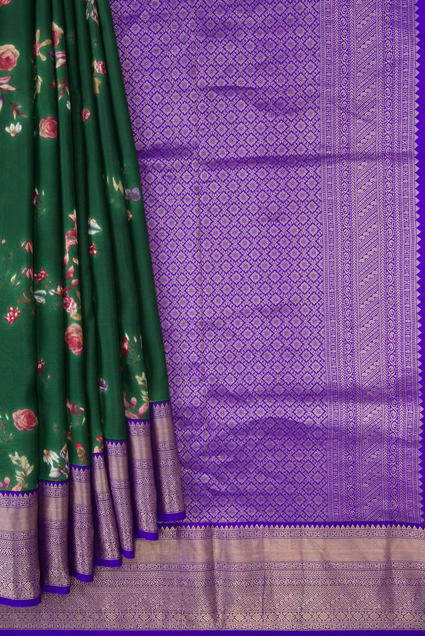 Pleats and pallu of Green Dual Tone Kanchipuram Silk Saree with Printed design on the body and Zari Border. 