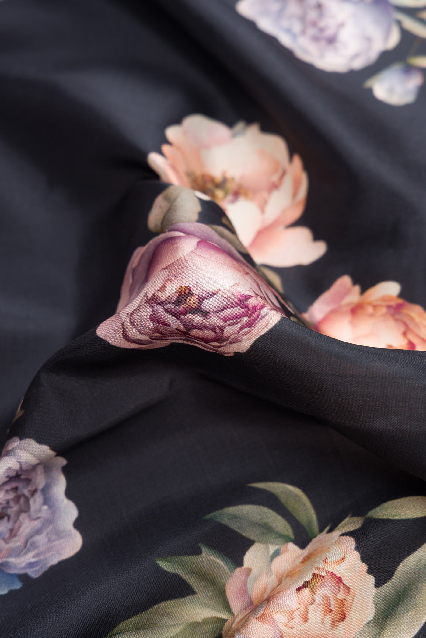 Close up of Navy Blue Dual Tone Kanchipuram Silk Saree with Printed design on the body and Zari Border.  displaying folds