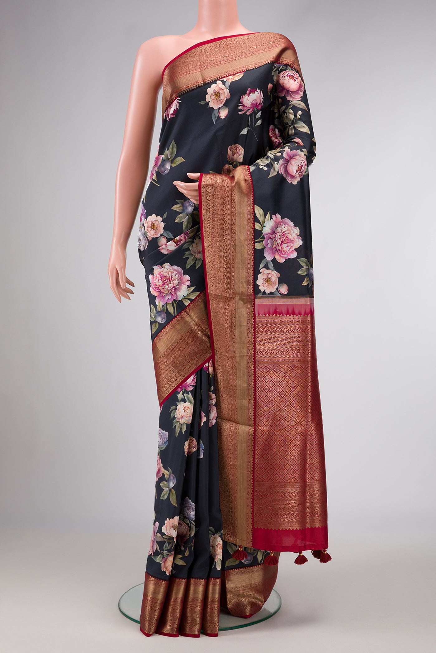 Navy Blue Dual Tone Kanchipuram Silk Saree with Printed design on the body and Zari Border.  displayed on a mannequin