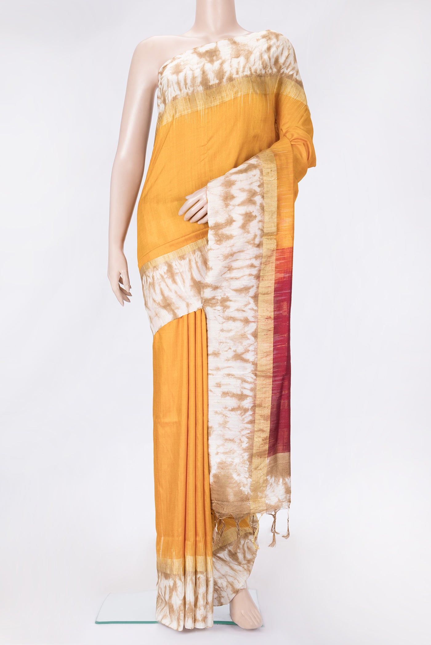 Mustard Dual Tone Tussar Silk Saree with Plain Body and Printed Border.  displayed on a mannequin