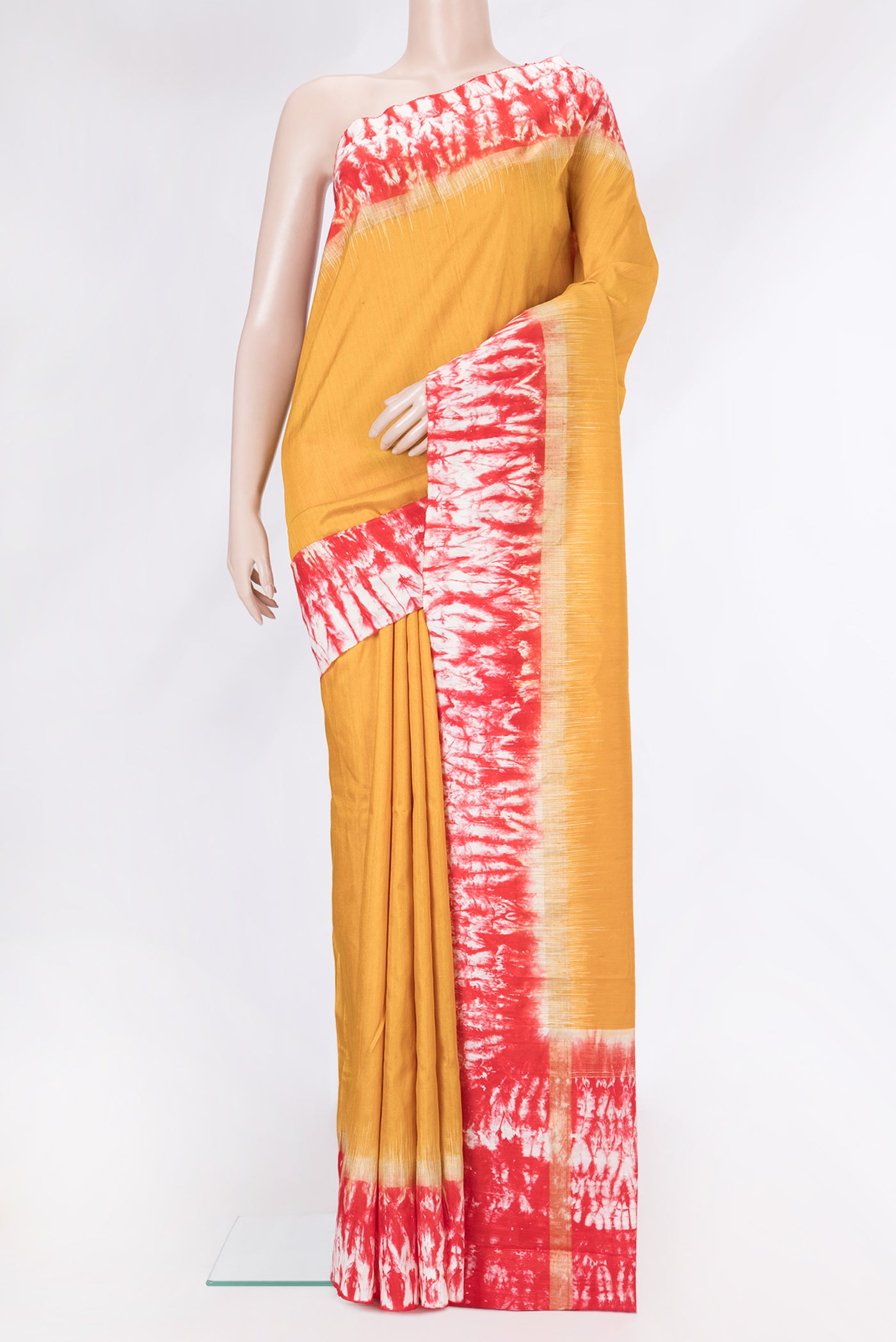 Yellow Tussar Silk Saree with Plain Body and Zari Border.  displayed on a mannequin