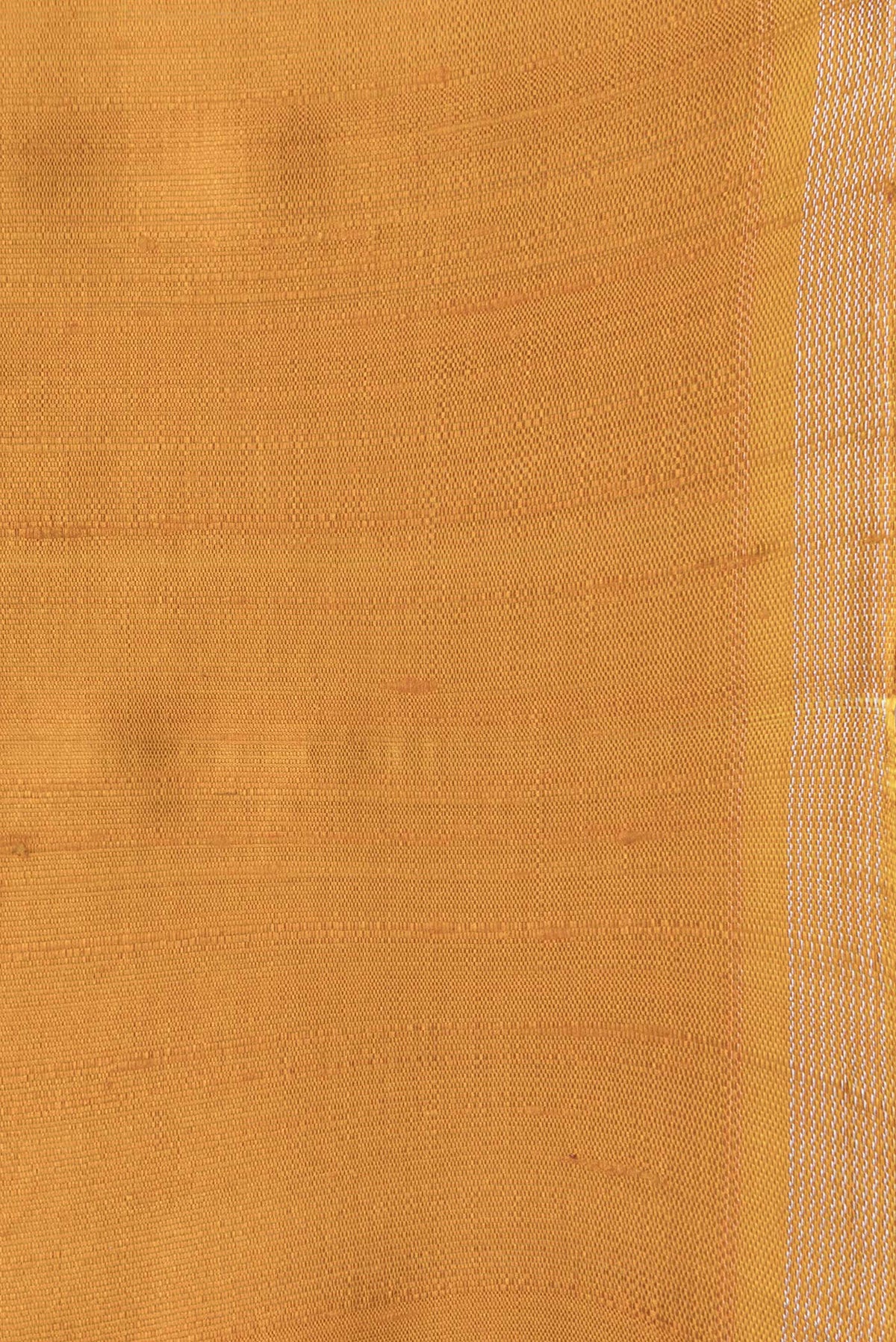 Border image of Mustard Dual Tone Raw Silk Saree with Plain Body and Thin Zari Line. 