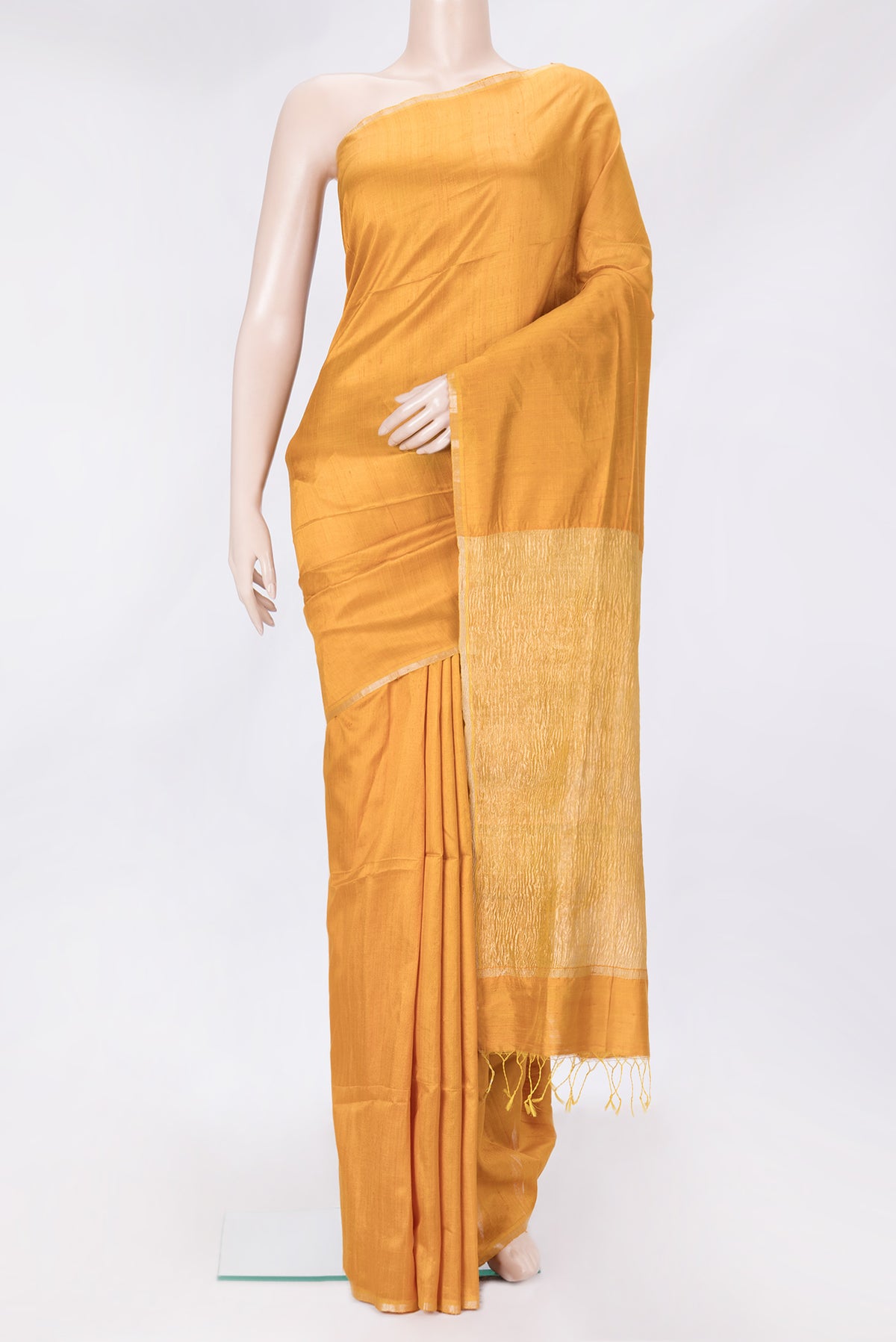 Mustard Dual Tone Raw Silk Saree with Plain Body and Thin Zari Line.  displayed on a mannequin