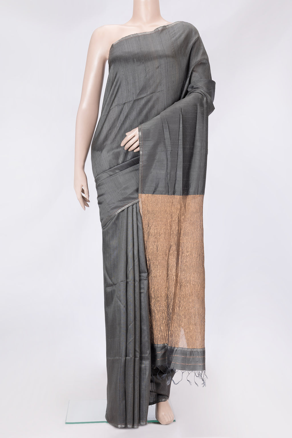 Grey Dual Tone Raw Silk Saree with Plain Body and Thin Zari Line.  displayed on a mannequin