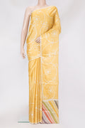 Yellow Tussar Silk Saree with Printed design on the body and Plain Border.  displayed on a mannequin
