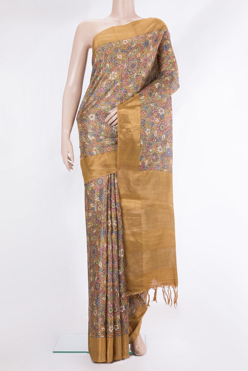 Pure Silk Mustard Tussar Saree with Printed design on the body and Zari Border.  displayed on a mannequin