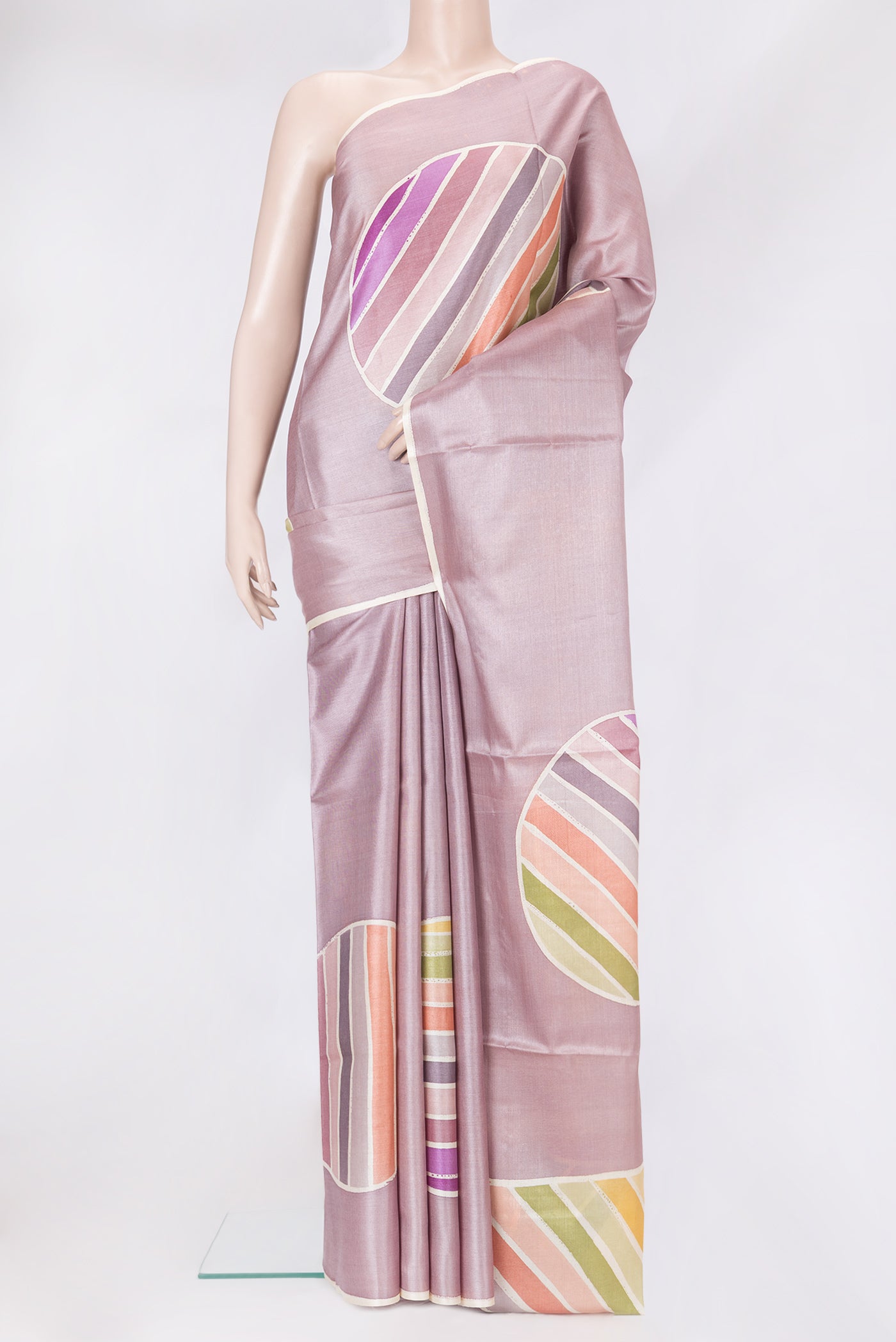 Lavender Tussar Silk Saree with Printed design on the body and Plain Border.  displayed on a mannequin