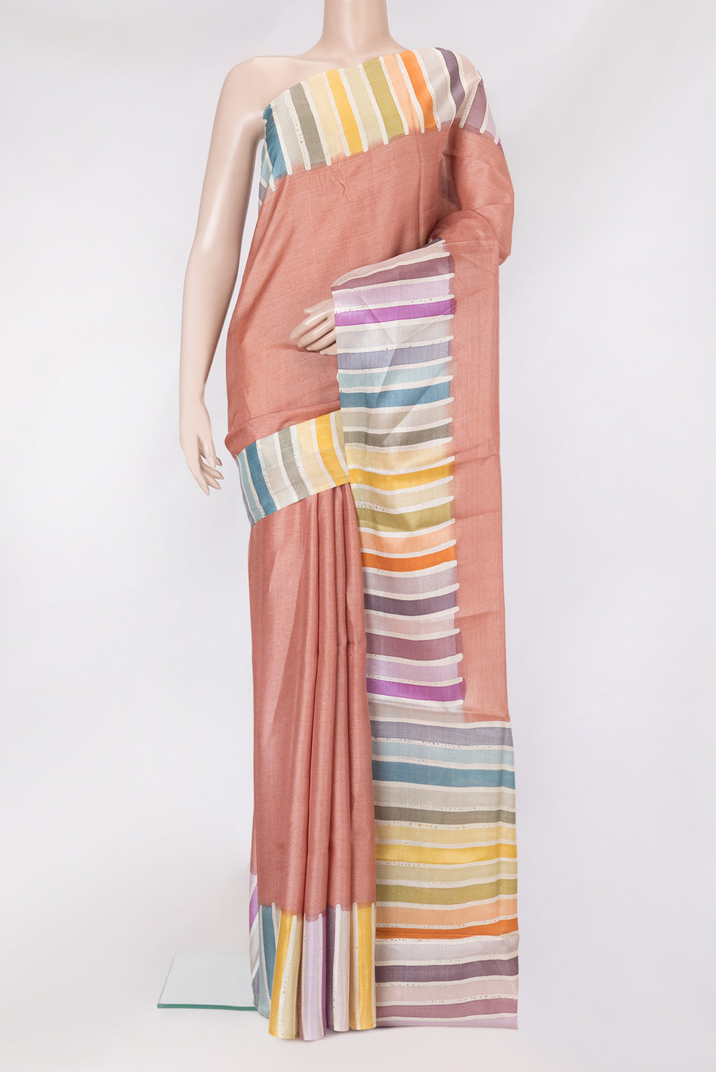 Golden Peach Tussar Silk Saree with Plain Body and Fancy Border.  displayed on a mannequin