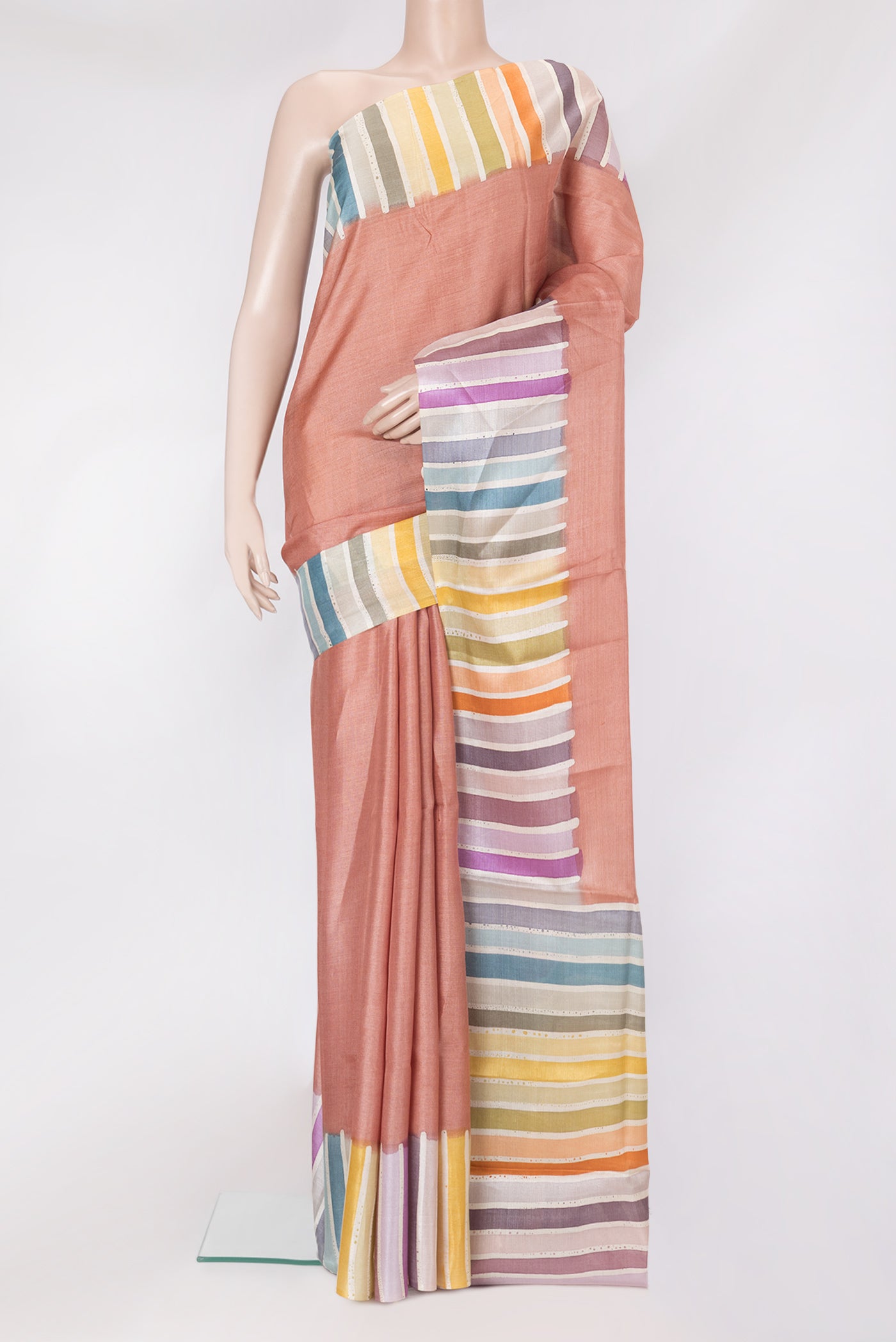 Golden Peach Tussar Silk Saree with Plain Body and Fancy Border.  displayed on a mannequin