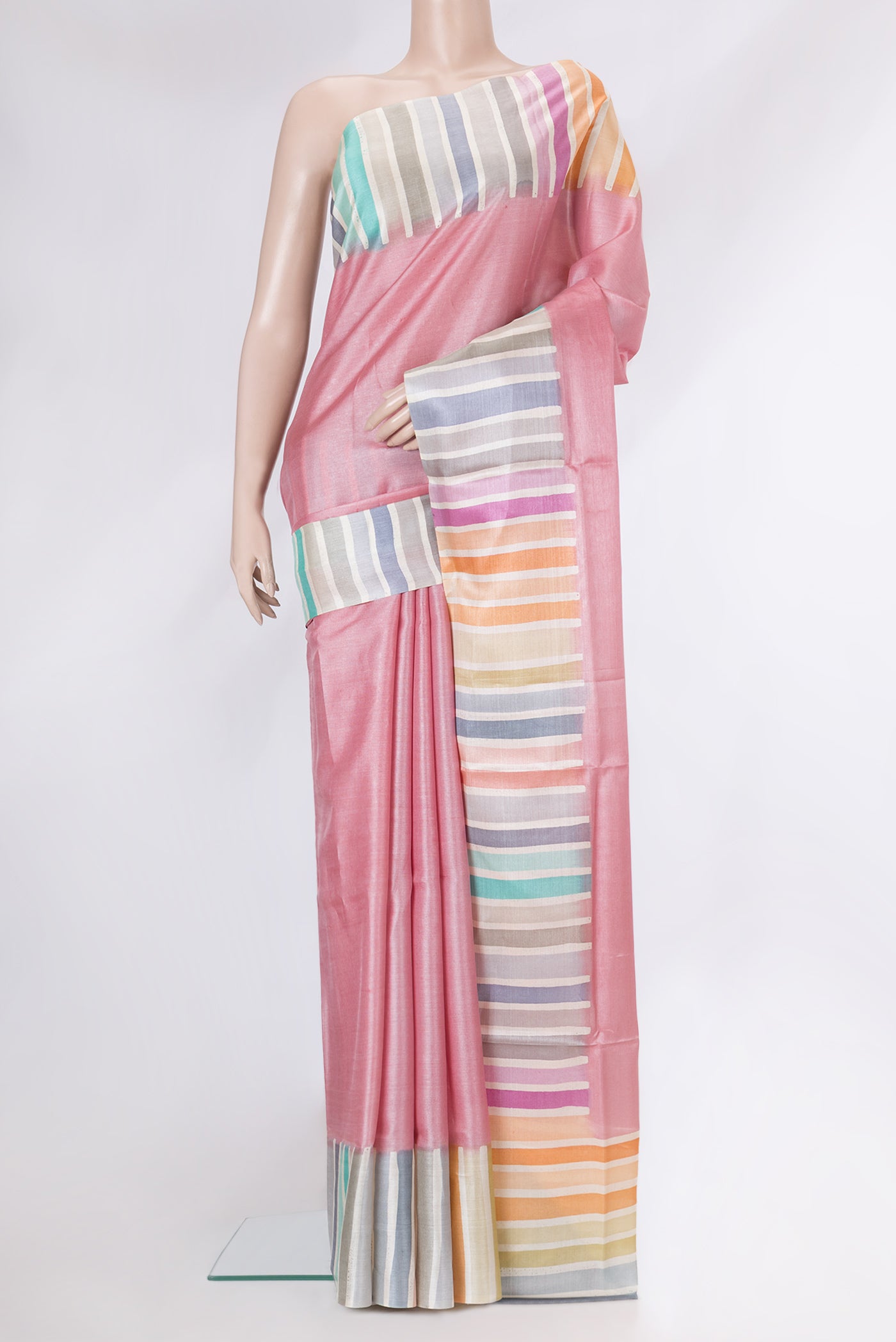 Rose pink Tussar Silk Saree with Plain Body and Fancy Border.  displayed on a mannequin