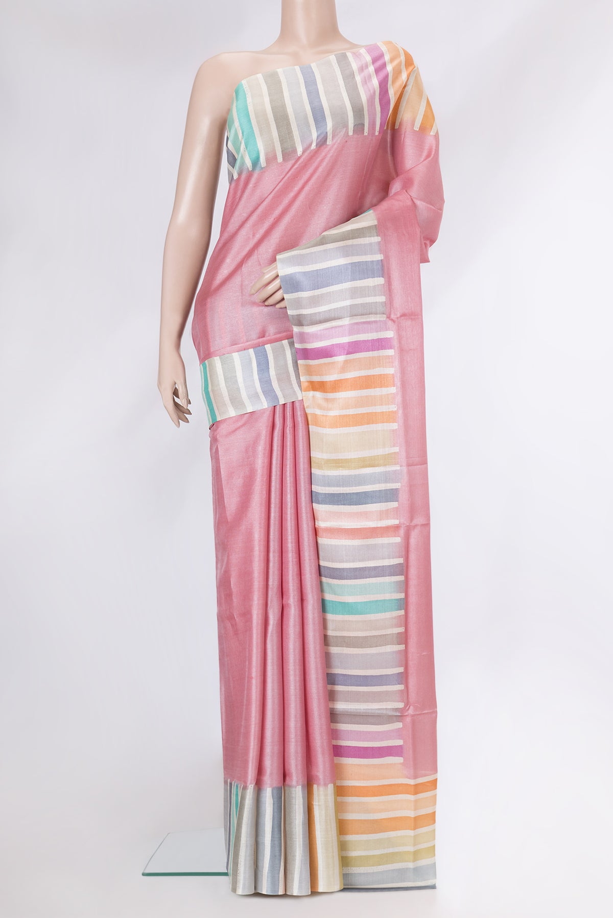 Rose pink Tussar Silk Saree with Plain Body and Fancy Border.  displayed on a mannequin