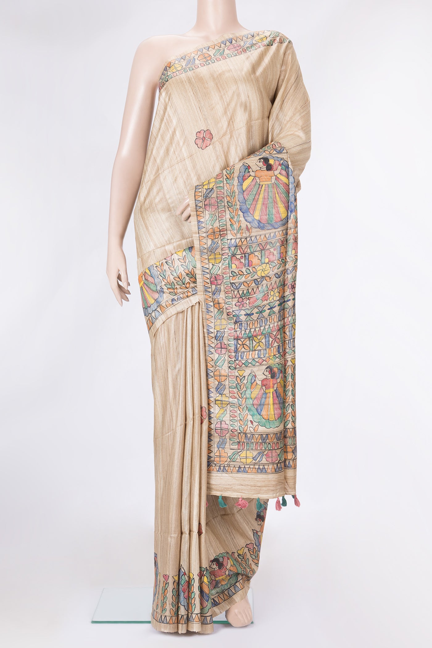Beige Dual Tone Tussar Silk Saree with Printed design on the body and Fancy Border.  displayed on a mannequin
